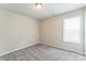 Bright bedroom with plush carpet and a large window at 13413 Golden Apple Ct, Charlotte, NC 28215