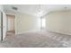 Cozy bedroom with plush carpet, neutral walls, and closet at 13413 Golden Apple Ct, Charlotte, NC 28215