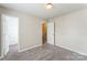 Neutral bedroom featuring soft carpet, and an entrance to the closet at 13413 Golden Apple Ct, Charlotte, NC 28215