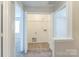 Walk-in closet featuring shelving and laminate flooring at 13413 Golden Apple Ct, Charlotte, NC 28215