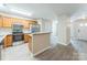 A kitchen boasting wood cabinets, stainless steel appliances, and a gray countertop at 13413 Golden Apple Ct, Charlotte, NC 28215