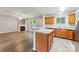 An open-concept layout showcasing seamless flow from the living room, fireplace, and kitchen at 13413 Golden Apple Ct, Charlotte, NC 28215