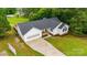 Aerial view of a beautiful home with a well-maintained lawn and garage at 1377 Beagle Run, Salisbury, NC 28146