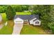 Aerial view of a charming home with a well-manicured lawn and driveway at 1377 Beagle Run, Salisbury, NC 28146