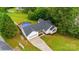 Aerial view of the home featuring pool, manicured lawn, and driveway at 1377 Beagle Run, Salisbury, NC 28146
