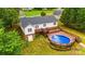 Inviting backyard features an above ground pool with deck, perfect for outdoor entertaining and relaxation at 1377 Beagle Run, Salisbury, NC 28146