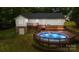 Inviting backyard features an above ground pool with deck, perfect for outdoor entertaining and relaxation at 1377 Beagle Run, Salisbury, NC 28146