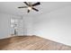 Bright bedroom features laminate flooring, a ceiling fan, and neutral walls, creating a welcoming space at 1377 Beagle Run, Salisbury, NC 28146