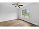 Sunlit bedroom with a ceiling fan, window, and neutral walls offers a serene retreat with laminate flooring at 1377 Beagle Run, Salisbury, NC 28146