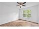 Bright bedroom with laminate flooring, a ceiling fan, and a large window showcases natural light at 1377 Beagle Run, Salisbury, NC 28146