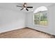 Bright bedroom with a ceiling fan, hardwood floors, and a large window at 1377 Beagle Run, Salisbury, NC 28146