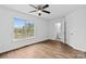 Airy bedroom with a ceiling fan, window views, and light walls enhances the relaxing atmosphere with laminate flooring at 1377 Beagle Run, Salisbury, NC 28146