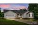 Charming one-story home with an attached garage and well-maintained front yard landscaping at 1377 Beagle Run, Salisbury, NC 28146