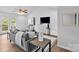 Comfortable living room with a ceiling fan, neutral tones, and access to the backyard at 1377 Beagle Run, Salisbury, NC 28146