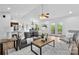 Open-concept living room with hardwood floors, natural light, and a view into the kitchen at 1377 Beagle Run, Salisbury, NC 28146