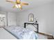 A well lit main bedroom featuring an ensuite bathroom and ceiling fan at 1377 Beagle Run, Salisbury, NC 28146