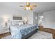 Comfortable main bedroom with fan, large window, and ensuite bathroom at 1377 Beagle Run, Salisbury, NC 28146