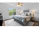 Comfortable main bedroom with large window offering lots of natural light and ceiling fan at 1377 Beagle Run, Salisbury, NC 28146