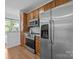 Well-equipped kitchen boasts stainless steel appliances, wooden cabinets, and ample counter space at 1556 Walnut View Dr, Charlotte, NC 28208