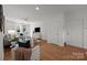 Comfortable living room with hardwood floors, a ceiling fan, and a bright white interior at 1556 Walnut View Dr, Charlotte, NC 28208