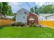 Beautiful backyard showcasing lush green grass, a charming patio, and vibrant plants, perfect for outdoor living at 2021 Charlotte Dr, Charlotte, NC 28203