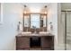 Bathroom featuring double sink vanity with dark wood cabinetry, brown marble countertop and mosaic backsplash at 2021 Charlotte Dr, Charlotte, NC 28203