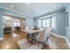 Charming dining room with hardwood floors, recessed lighting, and a large window at 2021 Charlotte Dr, Charlotte, NC 28203