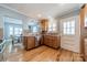 The kitchen has stainless steel appliances, wood cabinets and hardwood floors at 2021 Charlotte Dr, Charlotte, NC 28203