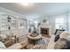 Elegant living room featuring built-in shelves, a cozy fireplace, and comfortable seating arrangement at 2021 Charlotte Dr, Charlotte, NC 28203