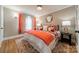 Bright main bedroom featuring an area rug, neutral colored walls, and ample lighting at 2021 Charlotte Dr, Charlotte, NC 28203