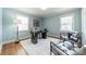 Light-filled office with hardwood floors, a cozy rug, and stylish furnishings creating an inviting workspace at 2021 Charlotte Dr, Charlotte, NC 28203