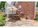 Outdoor patio for relaxation featuring a table with chairs and an umbrella, perfect for outdoor dining at 2021 Charlotte Dr, Charlotte, NC 28203