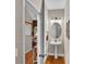 Cozy powder room featuring a pedestal sink, hardwood floors, and neutral decor, conveniently located off the hallway at 2030 Fasana Rd, York, SC 29745