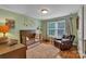 Charming Bedroom with a crib, plush armchair, and ample natural light from the window at 2030 Fasana Rd, York, SC 29745