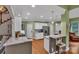 Well-lit kitchen featuring granite counters, stainless steel appliances, and hardwood flooring at 2030 Fasana Rd, York, SC 29745