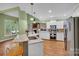 Modern kitchen featuring granite countertops, stainless steel appliances, and hardwood flooring at 2030 Fasana Rd, York, SC 29745