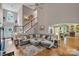 Bright, open-concept living space with hardwood floors, a vaulted ceiling, and ample natural light at 2030 Fasana Rd, York, SC 29745