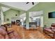 Open-concept living area with hardwood floors connecting to a kitchen with white cabinets and stainless steel appliances at 2030 Fasana Rd, York, SC 29745