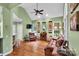 Inviting living area with high ceilings, hardwood floors, comfortable seating, and a decorative bar area at 2030 Fasana Rd, York, SC 29745
