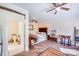 Charming bedroom with a queen bed, ceiling fan, and adjacent bathroom showcasing comfort and convenience at 211 Drive Inn Rd, Locust, NC 28097