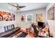 Cozy bedroom featuring hardwood floors, comfortable seating, and fun decor at 211 Drive Inn Rd, Locust, NC 28097