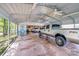 Well-lit carport housing multiple vehicles, providing ample covered parking space at 211 Drive Inn Rd, Locust, NC 28097