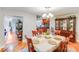 Elegant dining room with wood furniture set and seamless transition to the open kitchen at 211 Drive Inn Rd, Locust, NC 28097