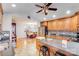 Well-equipped kitchen with stainless steel appliances and breakfast bar open to the dining area at 211 Drive Inn Rd, Locust, NC 28097