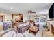 Open-concept living area with comfortable seating, a fireplace, and access to the kitchen at 211 Drive Inn Rd, Locust, NC 28097