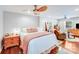 Bright and airy main bedroom featuring two ceiling fans and hardwood floors at 211 Drive Inn Rd, Locust, NC 28097