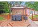 Outdoor kitchen with a grill, food preparation area, and seating, perfect for summer dining at 211 Drive Inn Rd, Locust, NC 28097