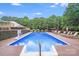 Inviting pool with surrounding deck area and lounge chairs, ideal for outdoor entertainment at 211 Drive Inn Rd, Locust, NC 28097