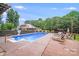 Sparkling pool with deck and lounge chairs, perfect for relaxing in the backyard oasis at 211 Drive Inn Rd, Locust, NC 28097