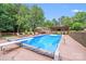 Refreshing pool with diving board, lounge chairs, and outdoor dining area, great for summer fun at 211 Drive Inn Rd, Locust, NC 28097